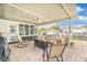 Waterfront patio with fire pit, comfortable seating, and view of the canal at 9485 Treasure Ne Ln, St Petersburg, FL 33702