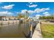 Waterfront property with canal views, boat dock, and lush landscaping at 9485 Treasure Ne Ln, St Petersburg, FL 33702