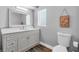Cozy bathroom featuring a white vanity and decorative wall art with a beachy vibe at 9591 Commodore Dr, Seminole, FL 33776