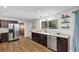 Kitchen showcasing stainless fridge, sleek cabinets, and durable countertops at 9591 Commodore Dr, Seminole, FL 33776