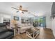 Bright living room featuring an open layout with connection to the outdoor pool area at 9591 Commodore Dr, Seminole, FL 33776