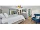 Bedroom showcasing hardwood floors, sliding glass doors and soothing decor at 9591 Commodore Dr, Seminole, FL 33776