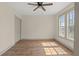 Bedroom with natural light, ceiling fan, and neutral walls at 100 E Fern St, Tampa, FL 33604