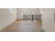 Bonus room featuring natural light and sleek trim, with wood laminate flooring at 100 E Fern St, Tampa, FL 33604