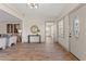Inviting entryway featuring hardwood floors, modern decor, and plenty of natural light at 100 E Fern St, Tampa, FL 33604