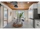 Bright kitchen featuring white cabinets, stainless steel refrigerator, and stylish butcher block countertops at 100 E Fern St, Tampa, FL 33604