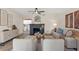 Cozy living room with stylish furniture, a modern fireplace, and wood floors at 100 E Fern St, Tampa, FL 33604