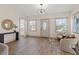 Inviting living room with wood floors, large windows, stylish décor, and comfortable seating at 100 E Fern St, Tampa, FL 33604