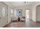 Comfortable seating in the living room featuring wood floors, modern lighting, and neutral colors at 100 E Fern St, Tampa, FL 33604