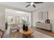 Bright living room featuring neutral tones, stylish decor, and hardwood floors at 100 E Fern St, Tampa, FL 33604