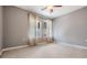 Bedroom with neutral carpet, large windows, and ceiling fan at 102 S Moody Ave # 1, Tampa, FL 33609