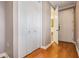 Hallway entrance featuring a gleaming wooden floor and a bathroom view at 102 S Moody Ave # 1, Tampa, FL 33609