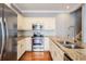 Gourmet kitchen featuring granite countertops and stainless steel appliances at 102 S Moody Ave # 1, Tampa, FL 33609