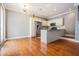 Kitchen featuring stainless steel appliances, modern lighting, and hardwood flooring at 102 S Moody Ave # 1, Tampa, FL 33609