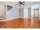 Open-concept living room with hardwood floors, staircase access and plenty of space for entertaining at 102 S Moody Ave # 1, Tampa, FL 33609