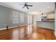 Well-lit living area with hardwood floors and a kitchen with stainless appliances at 102 S Moody Ave # 1, Tampa, FL 33609