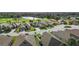Aerial view showcasing the home's location within a golf course community, highlighting its landscaped surroundings at 1111 Jasmine Creek Ct, Sun City Center, FL 33573