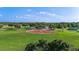 Scenic view of the community baseball field, perfect for outdoor recreation and Gathering fun in a vibrant neighborhood at 1111 Jasmine Creek Ct, Sun City Center, FL 33573