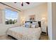 Bright bedroom features plush bedding, decorative pillows, and matching bedside lamps at 1111 Jasmine Creek Ct, Sun City Center, FL 33573