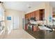 Kitchen with stainless steel appliances, granite countertops, tile flooring, and ample cabinet space at 1111 Jasmine Creek Ct, Sun City Center, FL 33573