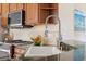 Close up of the kitchen featuring stainless steel appliances, and a spring faucet at 1111 Jasmine Creek Ct, Sun City Center, FL 33573