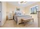 Comfortable primary bedroom featuring a queen-size bed, carpet flooring, and natural light at 1111 Jasmine Creek Ct, Sun City Center, FL 33573