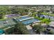 Aerial view showcasing multiple pickleball courts available for recreation in a vibrant, active community at 1111 Jasmine Creek Ct, Sun City Center, FL 33573