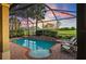 Enclosed pool area featuring a pool, patio, and lush landscaping, providing a private and serene outdoor retreat at 1111 Jasmine Creek Ct, Sun City Center, FL 33573