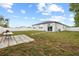 Expansive backyard featuring a grill, patio, and generous space for outdoor enjoyment at 11123 Thornberry Dr, Spring Hill, FL 34609