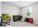 A bright bedroom featuring a window, filled with various household items ready to be unpacked at 11123 Thornberry Dr, Spring Hill, FL 34609