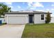 Charming single-Gathering home boasting a well-manicured lawn and solar panels for energy efficiency at 11123 Thornberry Dr, Spring Hill, FL 34609