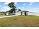 Well-maintained single-Gathering home with a spacious front yard, driveway and solar panels on the roof at 11123 Thornberry Dr, Spring Hill, FL 34609