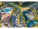 Aerial view of the community's pools, tennis courts, clubhouse, and playground all surrounded by lush greenery and walkways at 11354 Callisia Dr, Odessa, FL 33556
