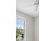 Bedroom showcases a ceiling fan and a window with blinds at 11354 Callisia Dr, Odessa, FL 33556