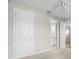 Bedroom features neutral carpet, ceiling fan, and connecting doors to other rooms at 11354 Callisia Dr, Odessa, FL 33556