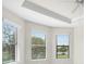 Bright bedroom with large windows, showing ample natural light and comfortable living space at 11354 Callisia Dr, Odessa, FL 33556