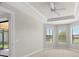Bright bedroom with large windows and ceiling fan, showing ample natural light and comfortable living space at 11354 Callisia Dr, Odessa, FL 33556