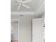 Bright bedroom with tray ceiling, ceiling fan, and views into the bathroom at 11354 Callisia Dr, Odessa, FL 33556