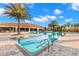 Resort-style pool with ample lounge seating, shaded areas, and beautiful tropical landscaping at 11354 Callisia Dr, Odessa, FL 33556