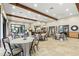 Spacious dining area perfect for gatherings, featuring round tables and neutral decor at 11354 Callisia Dr, Odessa, FL 33556