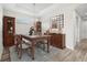 Dining room featuring a dining table, chairs, buffet, decorative mirror, and a chandelier at 11354 Callisia Dr, Odessa, FL 33556