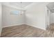 Empty dining room boasts natural light, tray ceiling, chandelier, and stylish flooring at 11354 Callisia Dr, Odessa, FL 33556