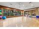 Bright fitness studio featuring hardwood floors and large windows overlooking the pool at 11354 Callisia Dr, Odessa, FL 33556