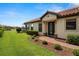 Charming single-story home with a red tile roof, manicured lawn, and inviting front entrance at 11354 Callisia Dr, Odessa, FL 33556