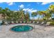 Inviting community hot tub surrounded by lounge chairs and lush landscaping for relaxation and socializing at 11354 Callisia Dr, Odessa, FL 33556