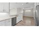 Open kitchen features stainless steel appliances, modern countertops, and ample cabinet space at 11354 Callisia Dr, Odessa, FL 33556