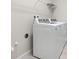 Efficient laundry area with a pair of modern appliances and wire shelving above at 11354 Callisia Dr, Odessa, FL 33556