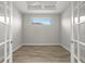 Bright office space with wood floors, French doors, and ceiling fan at 11354 Callisia Dr, Odessa, FL 33556