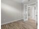 Home office with hardwood floors, white walls, and glass paneled French doors at 11354 Callisia Dr, Odessa, FL 33556
