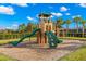 Fun community playground with climbing structures, slides, and green turf, ideal for recreation and enjoyment at 11354 Callisia Dr, Odessa, FL 33556